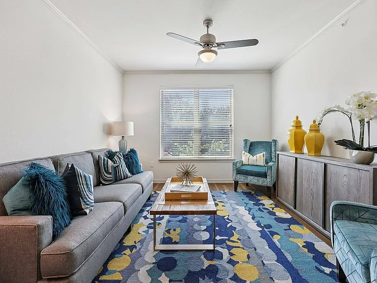 A bright and inviting living room designed for comfort at McDermott 55.
