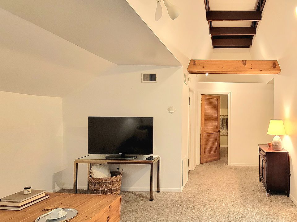 Showing living room, hallway and entrance to bedroom.