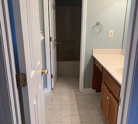 Master bath has separate room for shower/bath and toilet