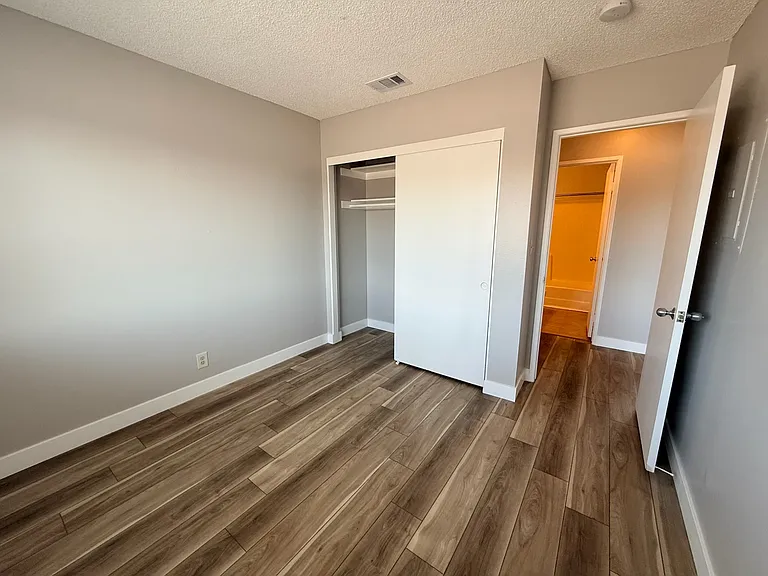Bedroom 2 with new paint and flooring