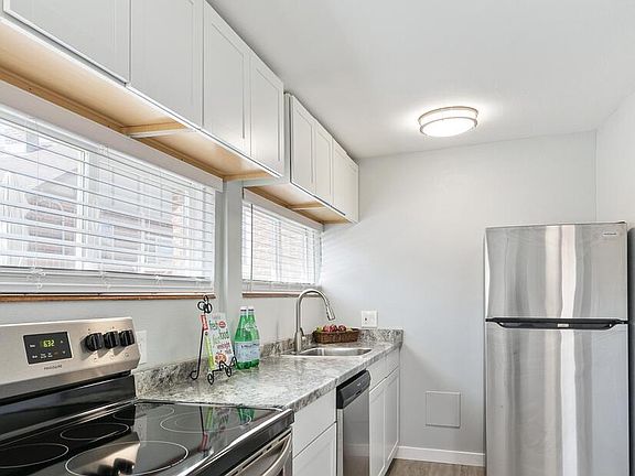 Kitchen View, Stainless Steel Stove/Range, Dishwasher, Refrigerator, Sink, Cabinets