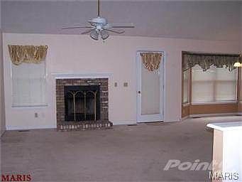 Great room with vaulted ceiling and fireplace