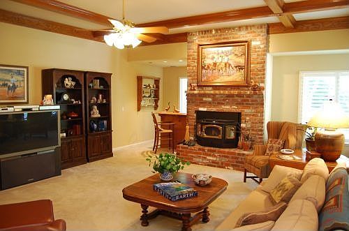 Family with wet bar, pellet insert and box beam ceilings
