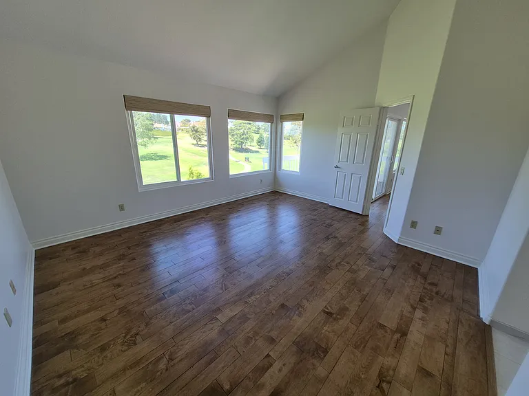 Upstairs suite has refinished wood floors, new window coverings and stunning golf course views.