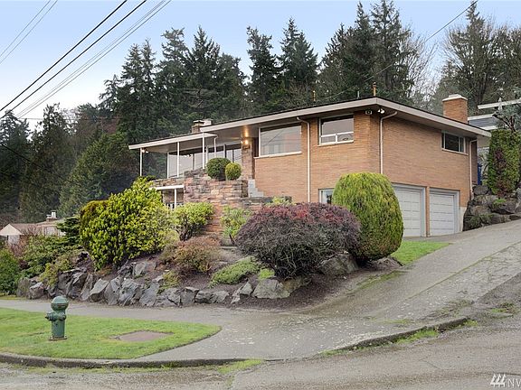 Welcome home! This lovely midcentury classic is in a prime location on a dead end street next to Schmitz Park, only a short drive to shops, restaurants and walking trails at Alki Beach and the Admiral Junction