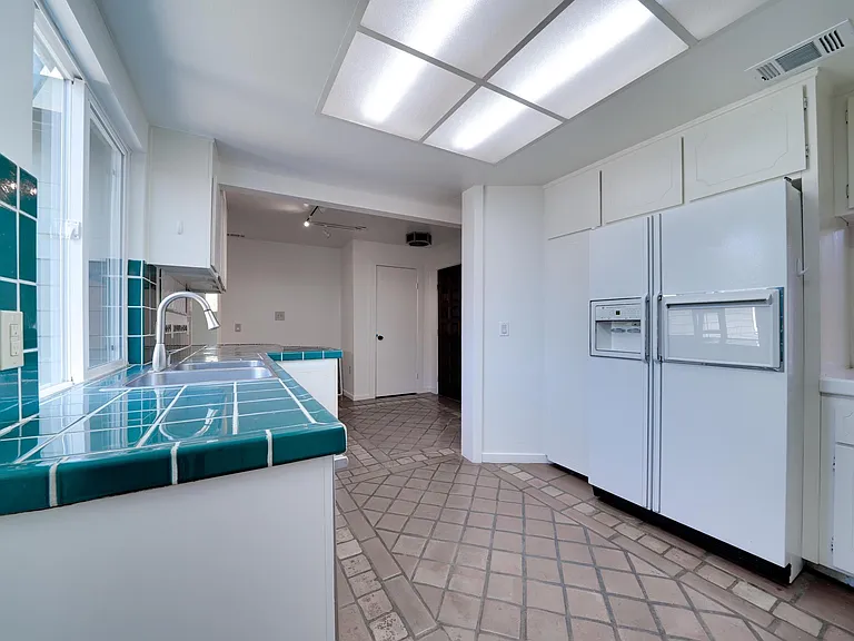 Another angle of the kitchen. Fridge and microwave included if tenant desires.