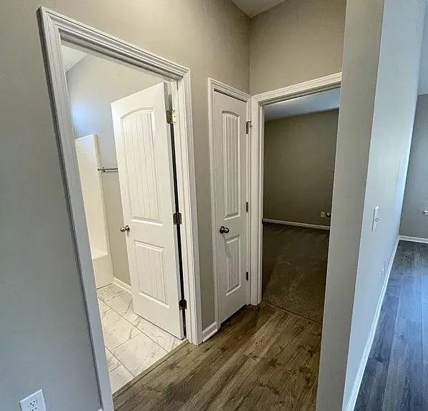 downstairs bath and hallway to extra bedrooms. hall closet.