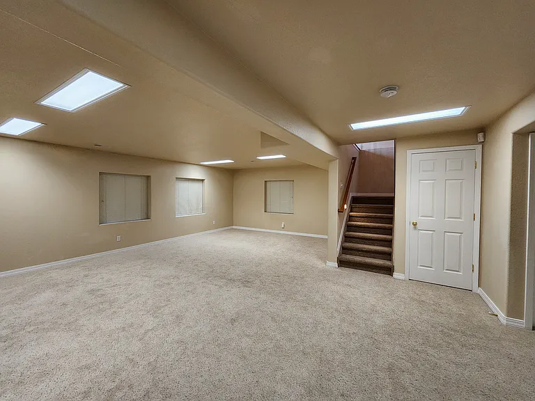 Lower Level Rec Room, storage closet to the right of the stairs