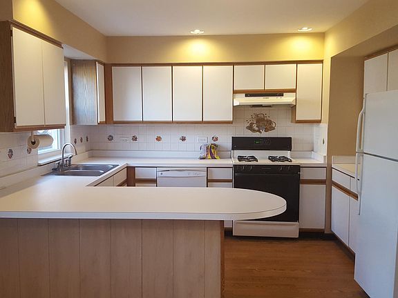 Tons of counter space, cabinetry and a dishwasher.