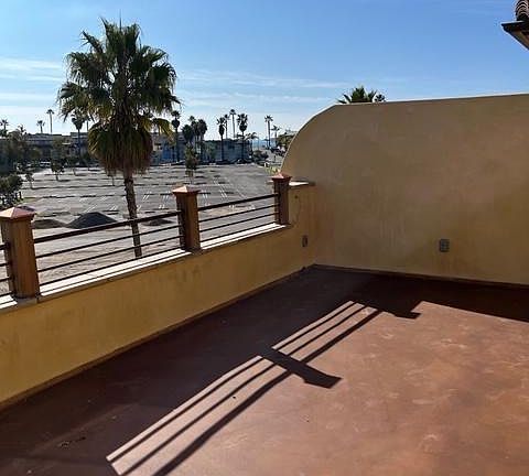 Top-level deck and views of ocean and the town of Avila