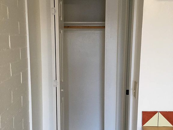 Closet to hang clothes and for storage.