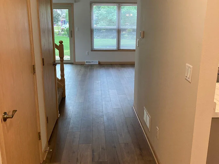 Entering in front door, coat closet on left, kitchen/dining on right