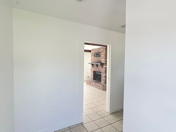 Entryway with view into den