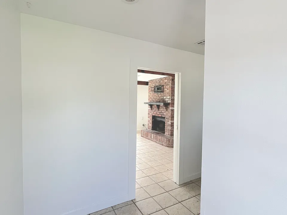 Entryway with view into den
