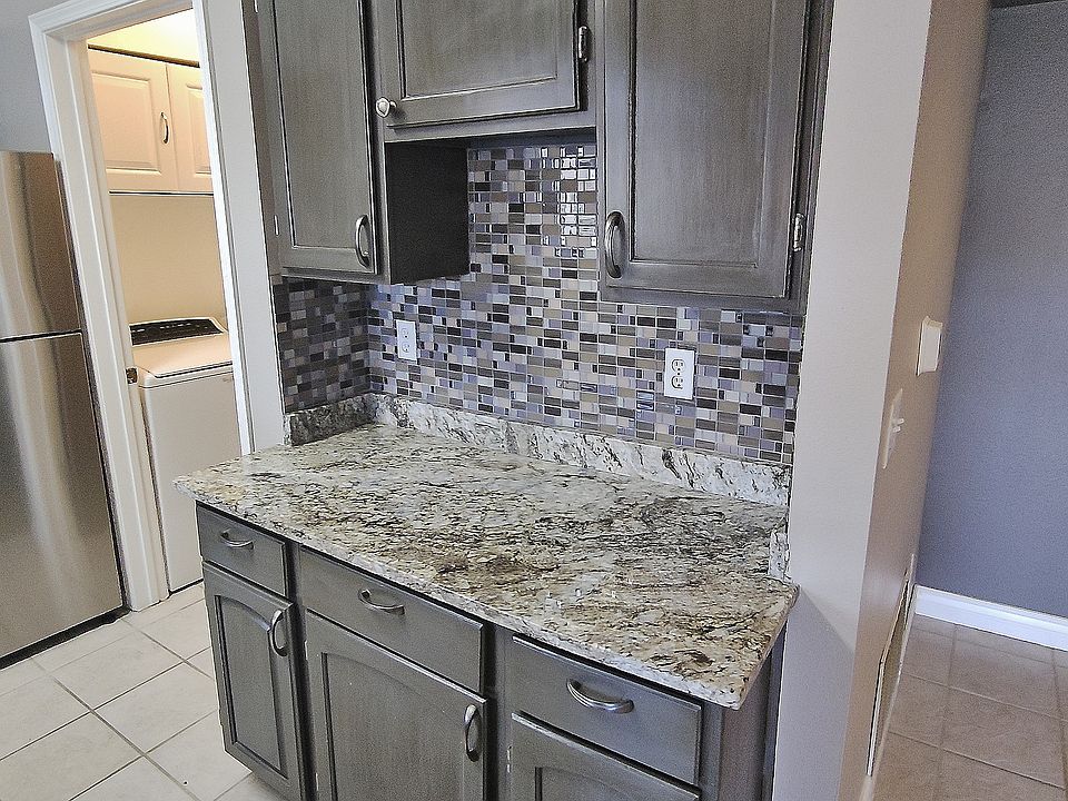 Custom Granite Kitchen, Glass Tile Backsplash, Extra Kitchen Prep Space with Painted Cabinetry