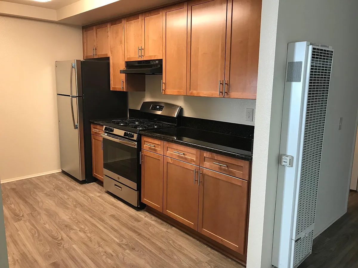 Right side of kitchen with stainless steel appliances - 4658 Wilson Ave