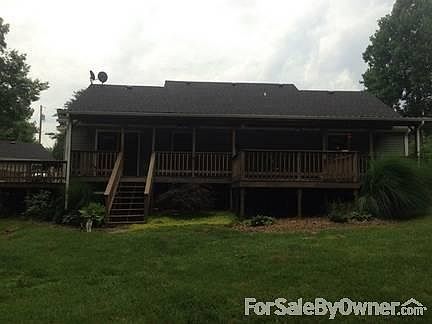 Rear view of house, deck