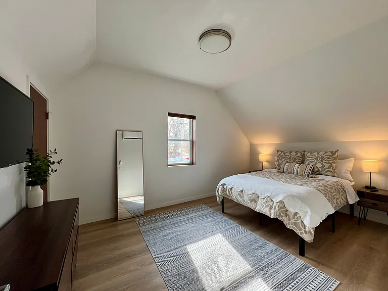 Bedroom #2 - Queen bed (or 2 twin beds, see next image), TV, closet & dresser, full length mirror, heat pump for heat/ac