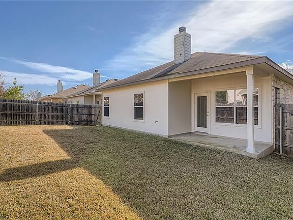 Covered back porch and fully enclosed backyard