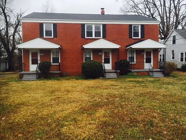 Brick Triplex and front yard