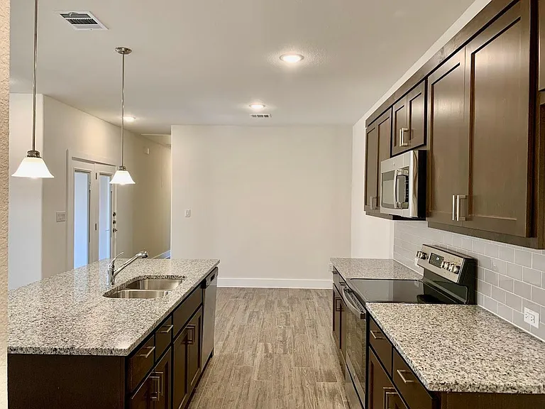 Kitchen opens into dining room