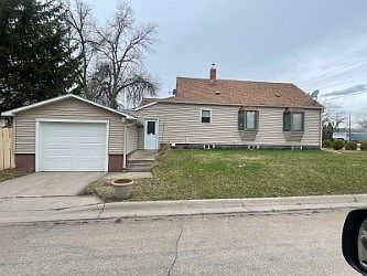 East side of the house, attached garage, bay windows