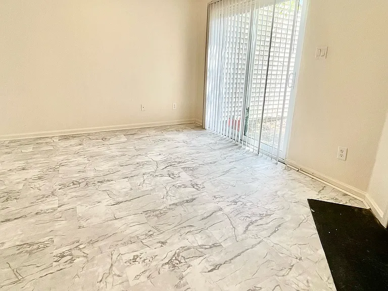 Living Room w/ Sliding Glass door to Backyard