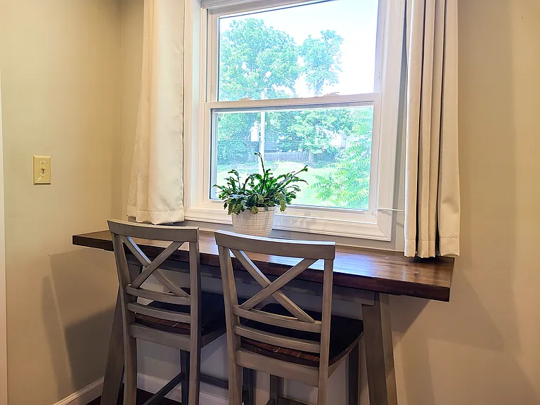 Bright and sunny. Window in the kitchen with a breakfast bar.