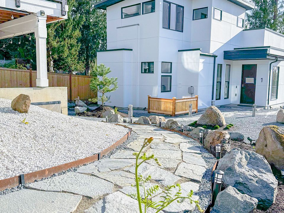 A view of the home from the pathway that you'll use to enter the property from the road.