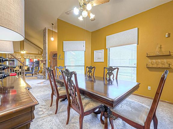 Formal dining opens up to the living room, great for entertaining guests.