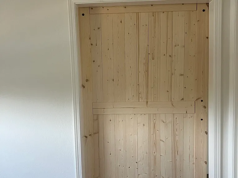 Barn door from inside living room / second bedroom
