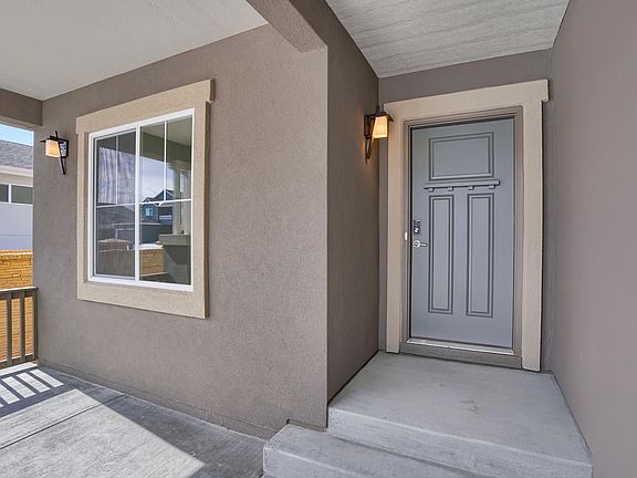 Welcoming Porch Photo representing home to be built and may demonstrate optional features