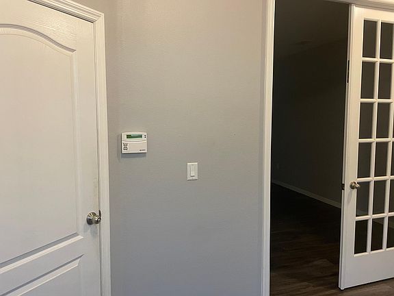 Downstairs office with glass fence doors to allow natural light in room