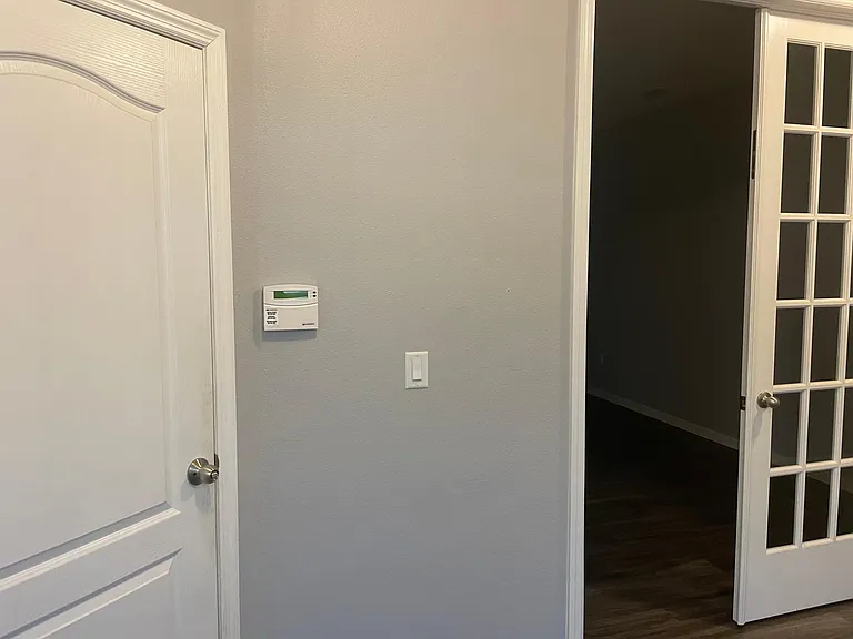 Downstairs office with glass fence doors to allow natural light in room