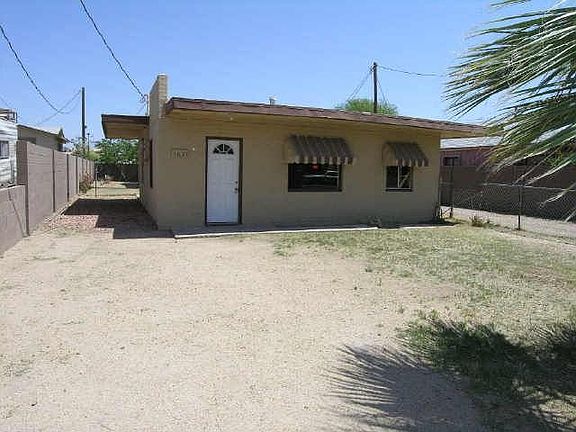 Front house is block construction, ceramic tile and flat roof