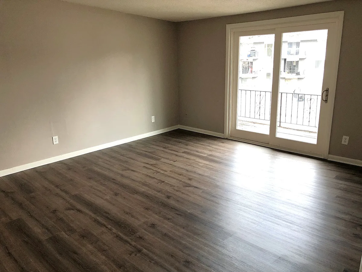Living Room, new flooring - 709 N 13th Ter #E