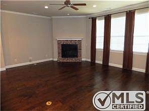 The large living room is open to the kitchen and dining area