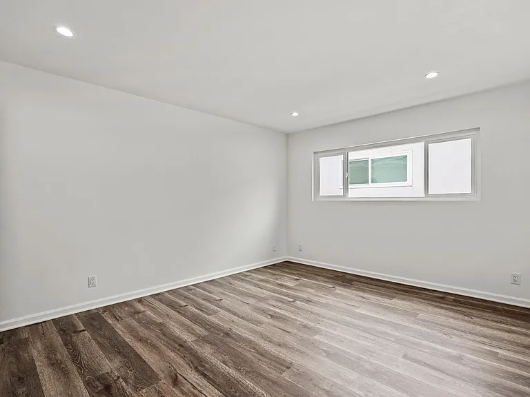Bedroom with Recessed Lighting, Vinyl Flooring, and Large Windows