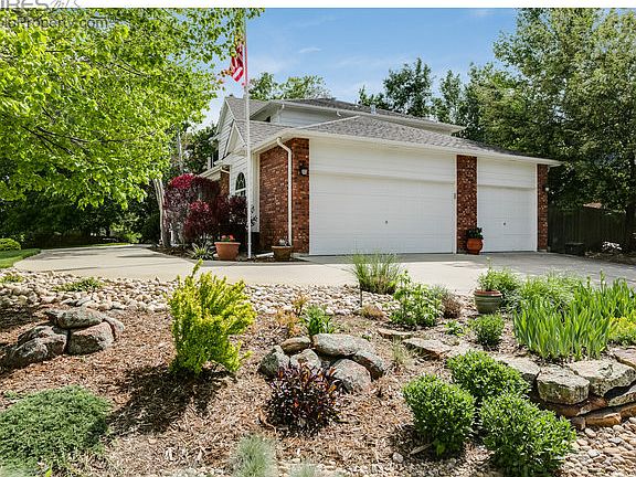 Circular driveway and sideload garage