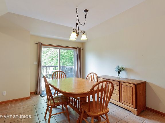 Here is the dining room with sliders out to the large deck and entertaining area! Plenty of room for