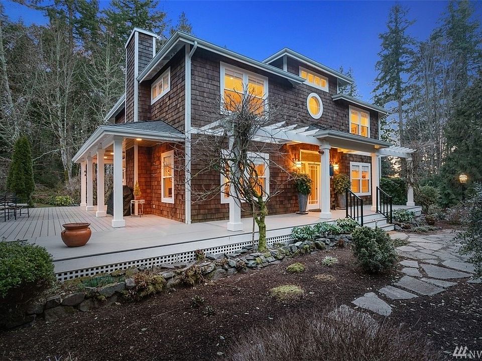 Classic shingle style Northwest home has a wonderful large level, sunny yard and beautiful garden space!