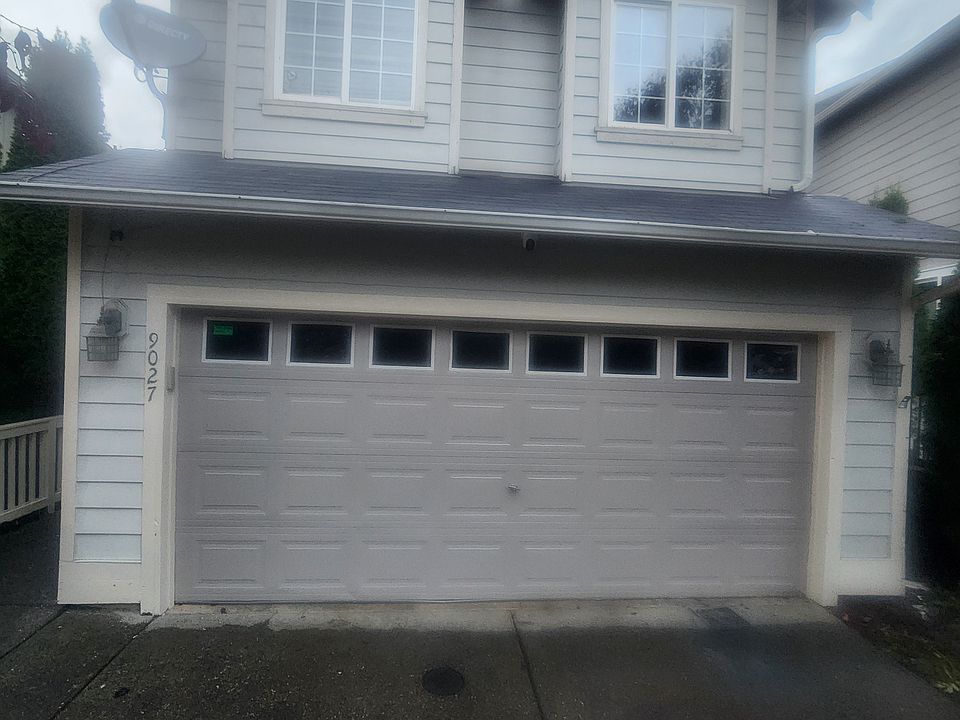 Newly painted exterior showing the garage door