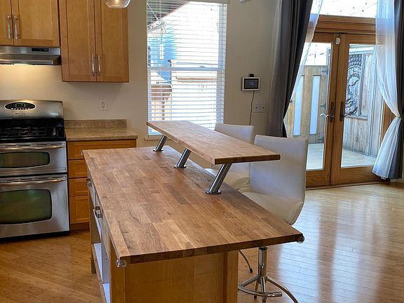 comfortable seating to enjoy guests while you cook.