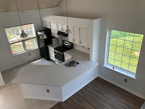 New quartz counter top, sink and fixture new electric stove.