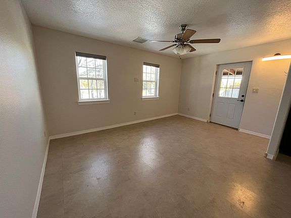 Living room with new cellular shades. Laminate floors (still need to be cleaned in these photos).