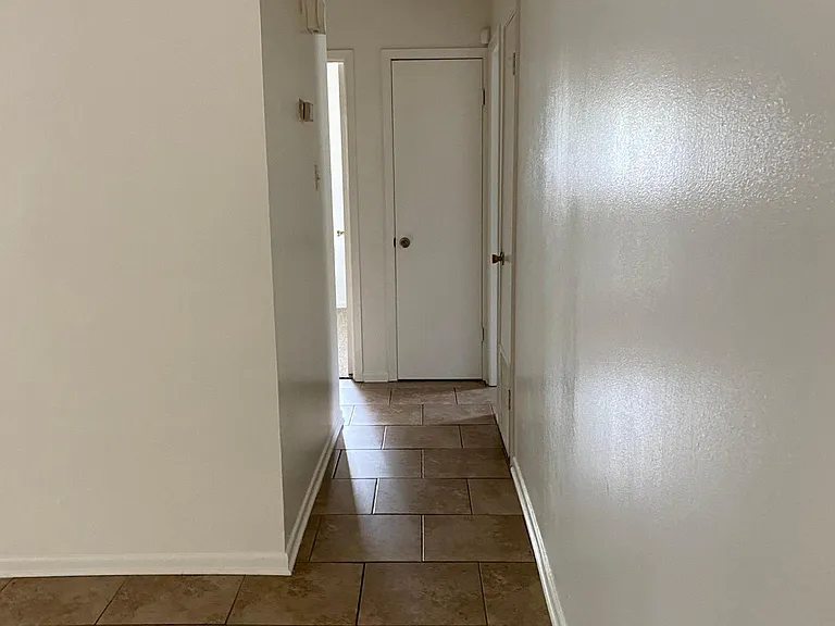 Hallway to bedrooms and bathrooms