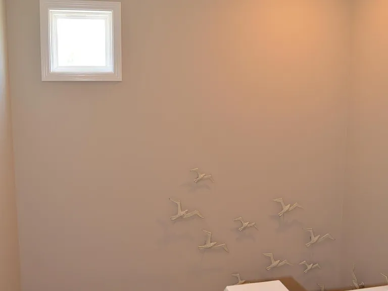 This small stairwell window adds to the theme of allowing natural light to shine throughout the house.