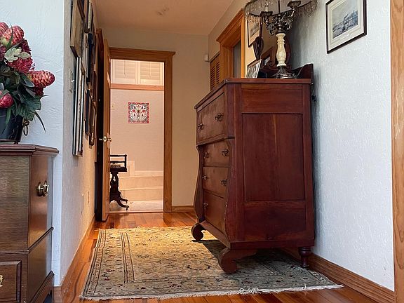 Exclusive upstairs suite with King Size bed and storage and marble bathroom with spa tub and shower.