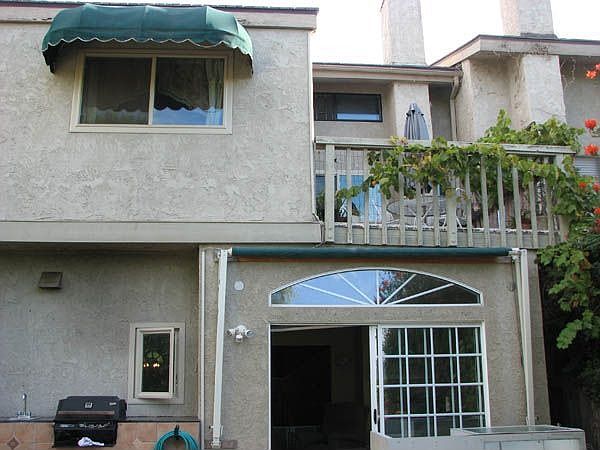 Back of the house with built in BBQ,master balcony and addidition
