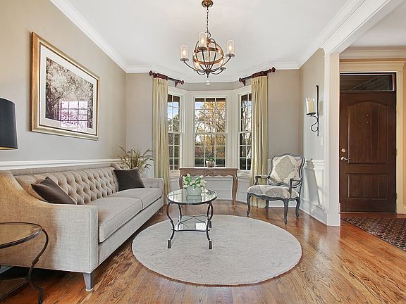 Elegant Living Room with chandelier and bay window.